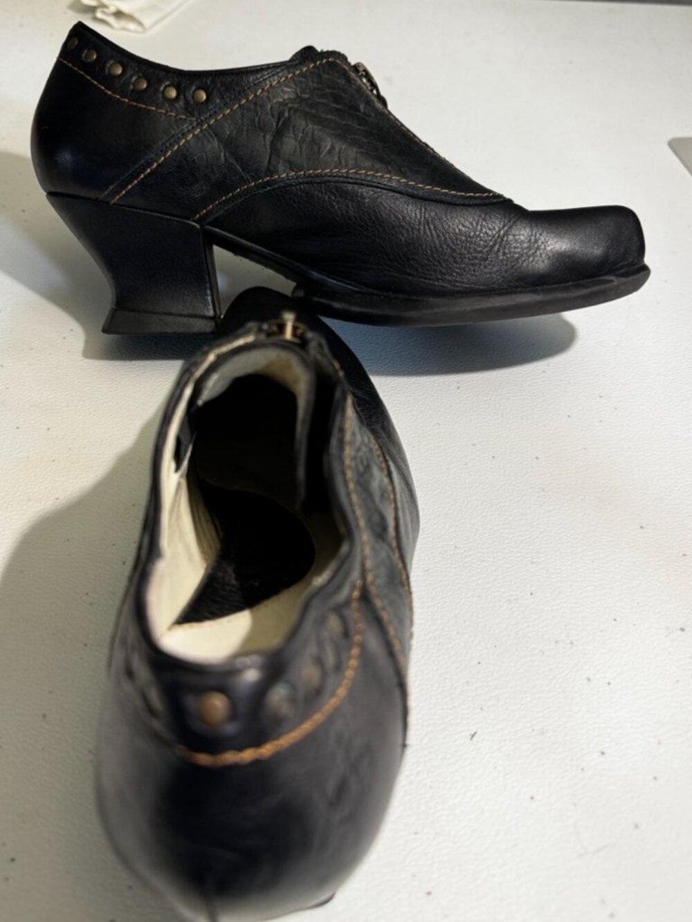 John Fluevog black low-heeled with zipper and stud styling